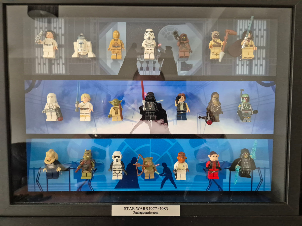 Collection of Star Wars mini figures displayed in a framed case with a blue background.
